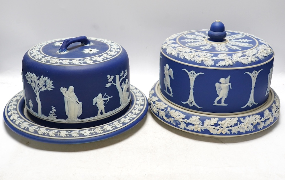 Two Wedgwood blue jasperware cheese dishes and covers, largest 29cm in diameter. Condition - good